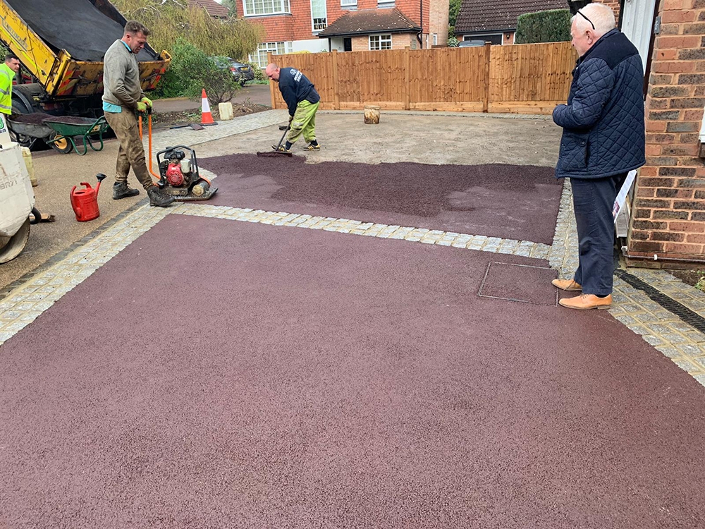 Driveway with tarmac being laid Driveway with tarmac being laid